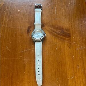 Tommy Bahama Analog Wristwatch with a Buckle Band and Water Resistance